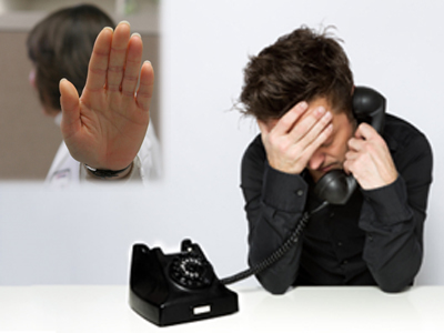 disgruntled man on phone opposite woman doctor putting hand up to stop any conversation