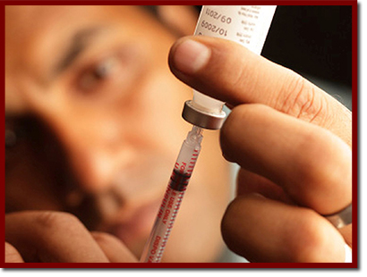 doctor filling a syringe